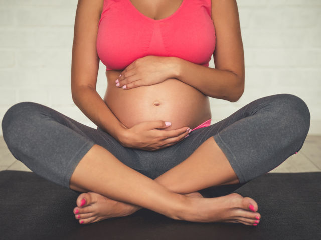 Pregnant woman doing yoga